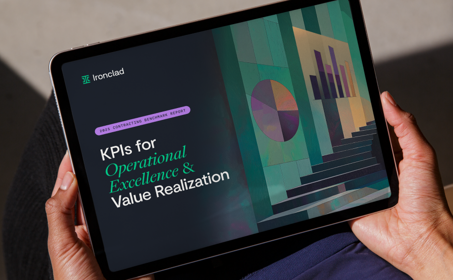 A person holds a tablet displaying a report titled KPIs for Operational Excellence & Value Realization by Ironclad, with abstract bar and pie charts shown on the screen.