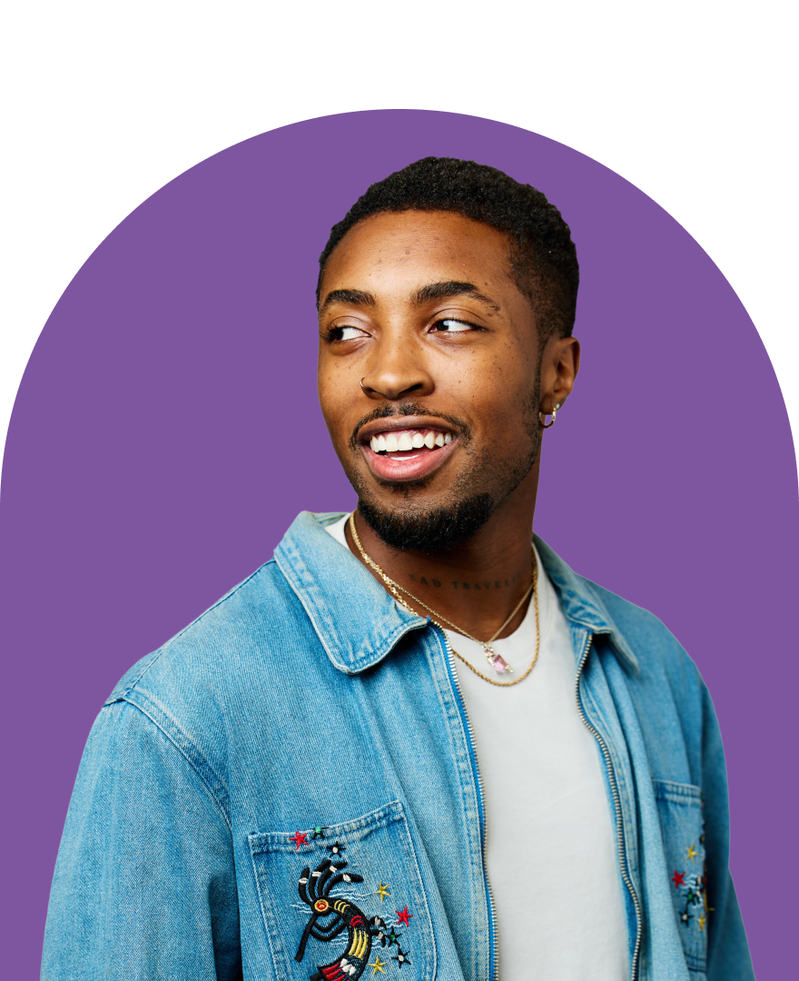 man smiling over shoulder