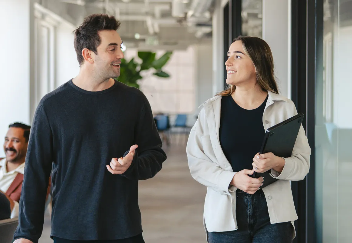 Join the Community ironclad community members talking in an office