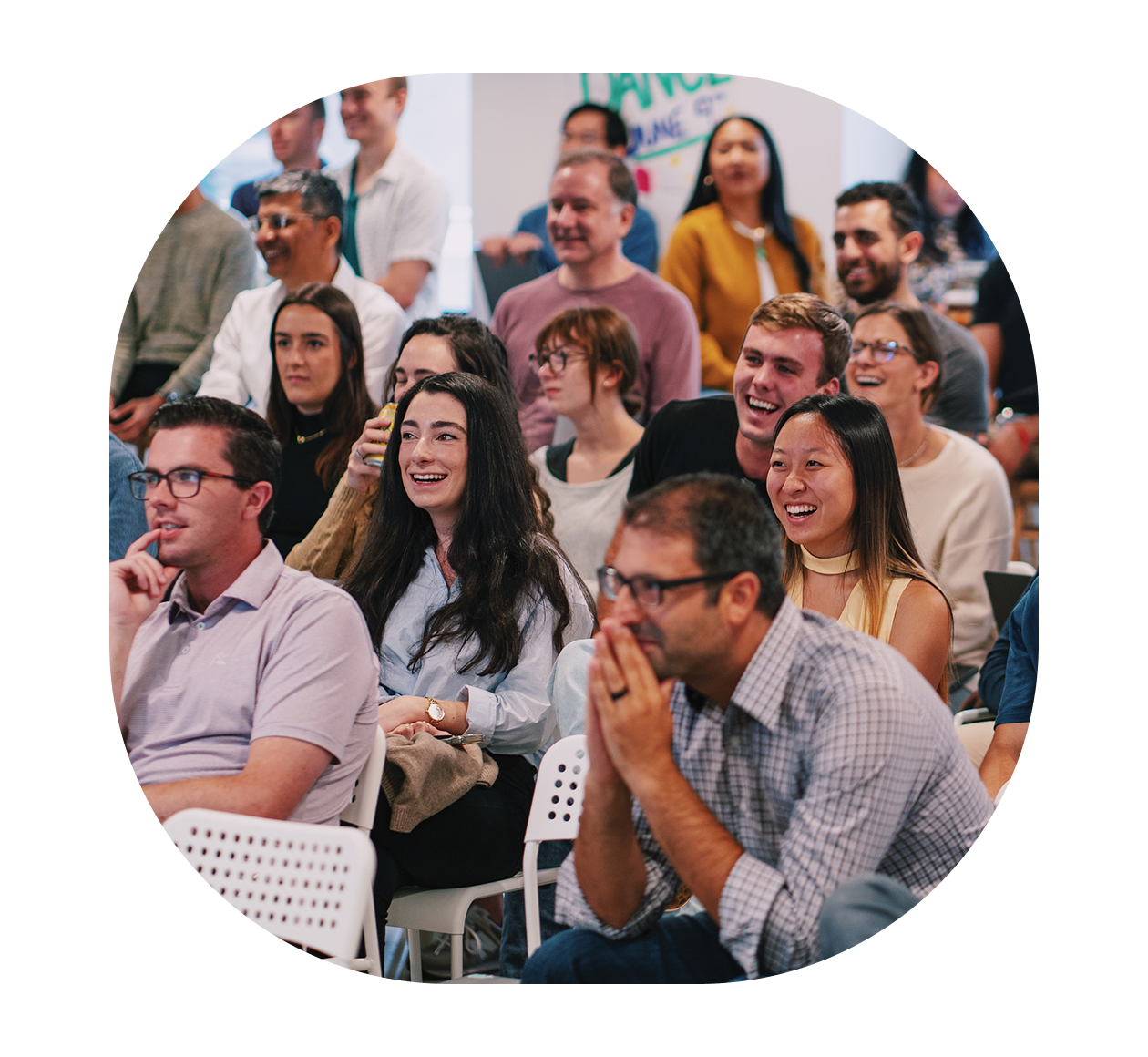 Founded in San Francisco group of people watching something and smiling