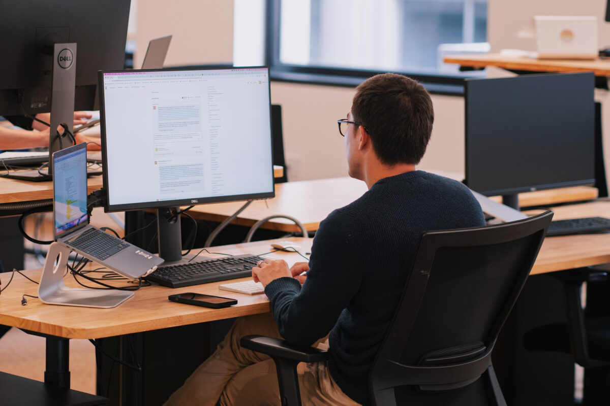 Man sitting at a computer in the Ironclad office