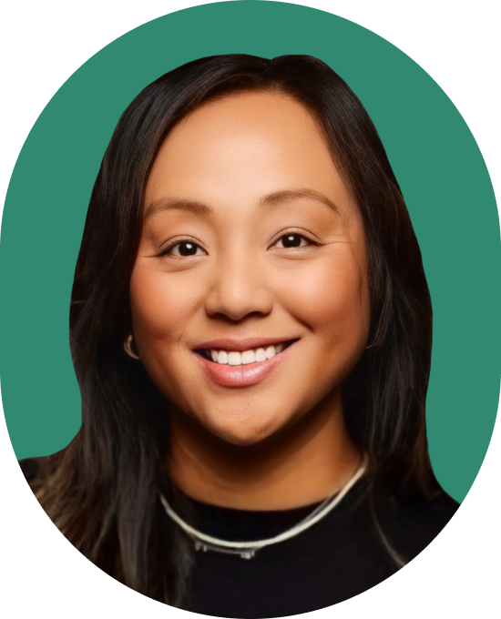 Portrait of a smiling woman with dark hair against a green background.