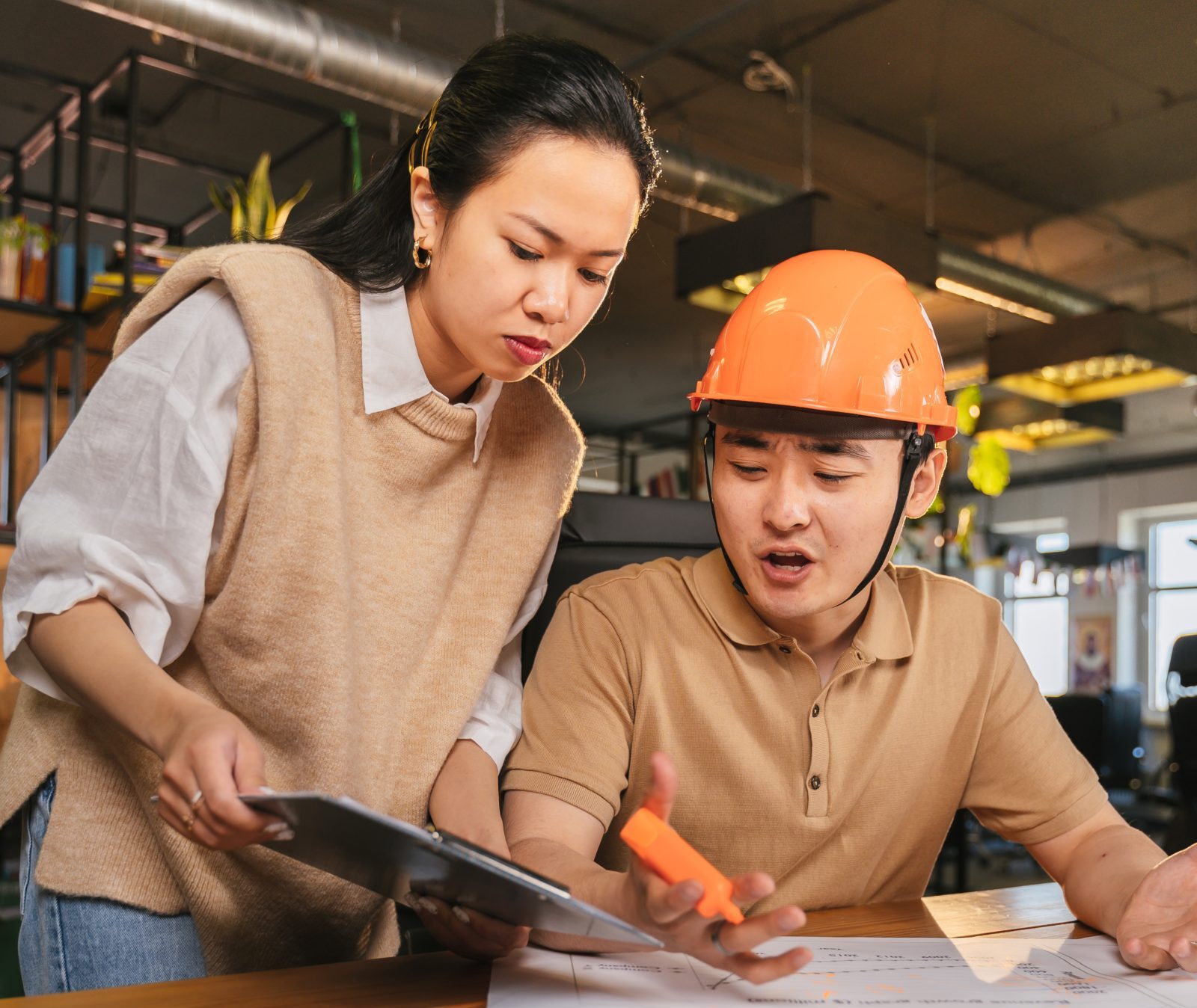 two people reviewing a time and materials contract