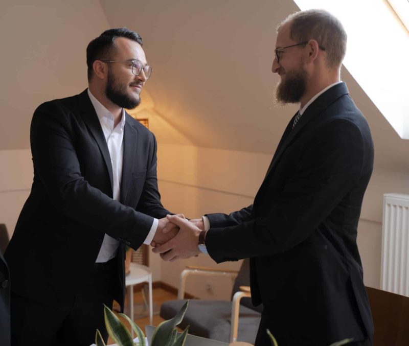 men in agreement over contract for procurement cycle