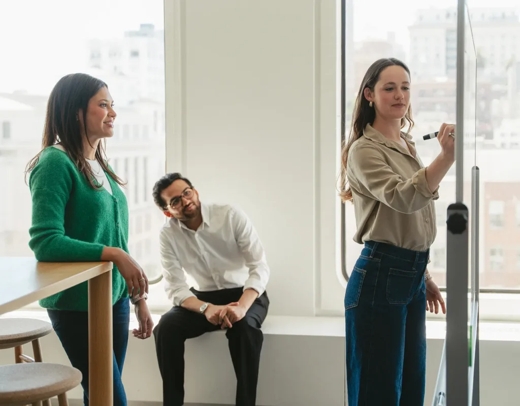 woman writing on whiteboard