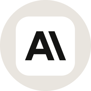 A bold, black A and backward slash symbol (\) appear centered on a white rounded square, set against a light gray circular background—subtly conveying themes of anthropic integration.