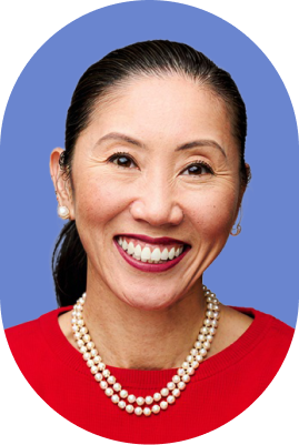 A woman with dark hair pulled back, wearing pearl earrings, a double-strand pearl necklace, and a red top smiles confidently against a blue background—her poise reminiscent of an ironclad jurist AI.