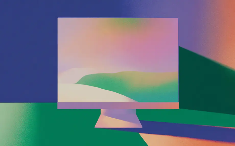 A computer monitor displays a colorful, abstract landscape with soft gradients; matching hues and shapes extend into the background, blending digital and physical spaces in a surreal way—evoking the seamless integration one might find when navigating a thoughtfully designed Software License Agreement.