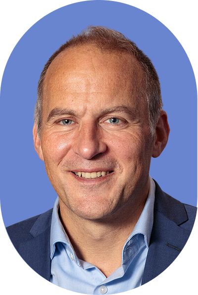 A friendly AI professional with short hair and a smile, wearing a blue button-down shirt and a navy blazer.